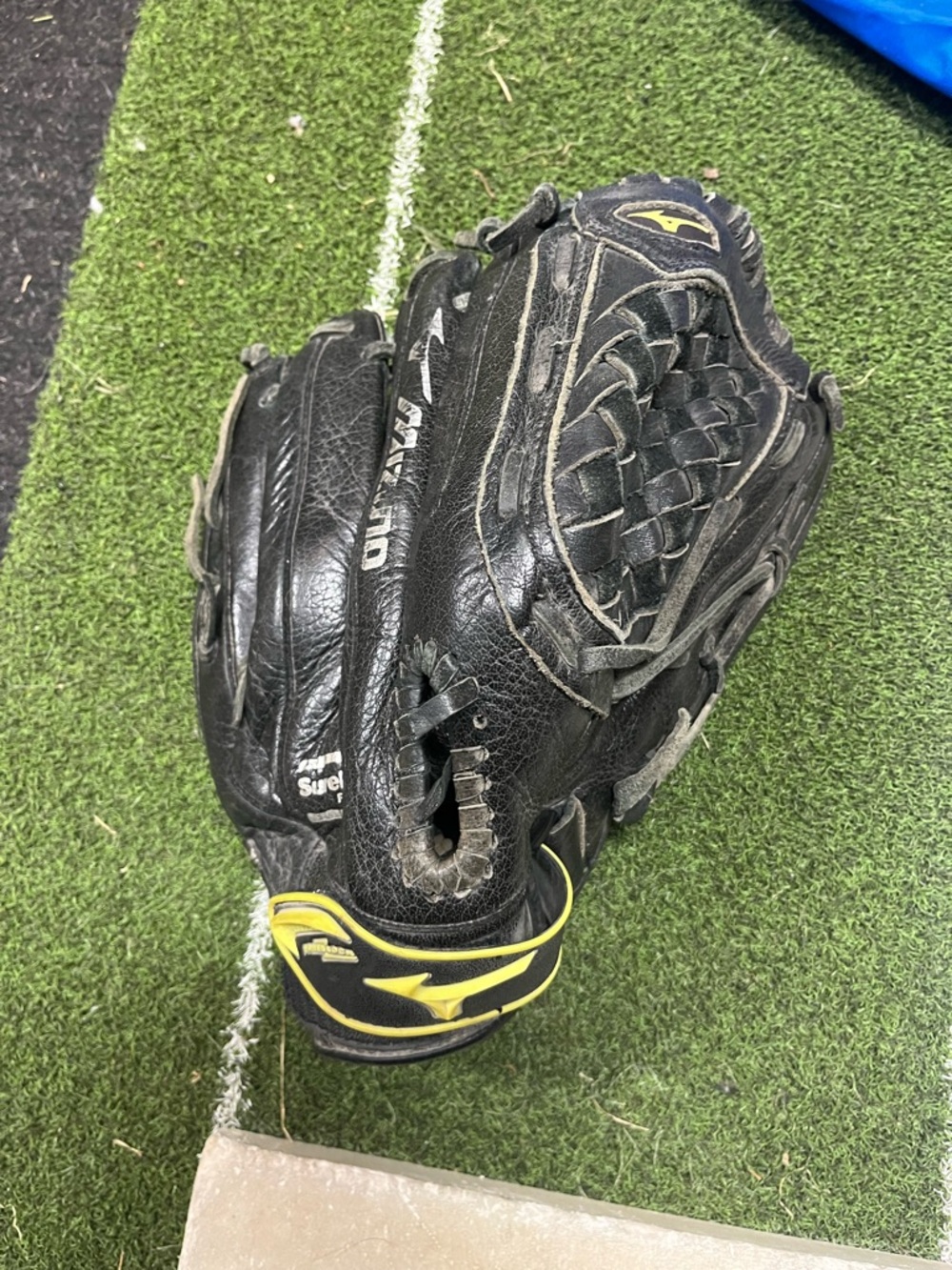 Mizuno Black and Yellow Youth Softball Glove with Woven Web